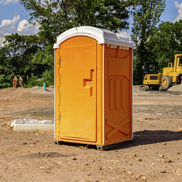 what is the cost difference between standard and deluxe porta potty rentals in Honey Grove